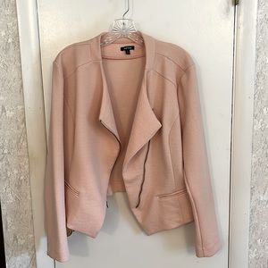 Stretchy in the arms and shoulders. I wore this through me being a solid 2x.